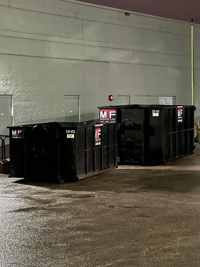 Two dumpster bins at job site