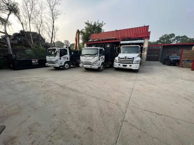 Three MTF Group trucks lined up in yard