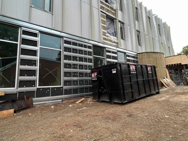 Dumpster bin at commercial building site